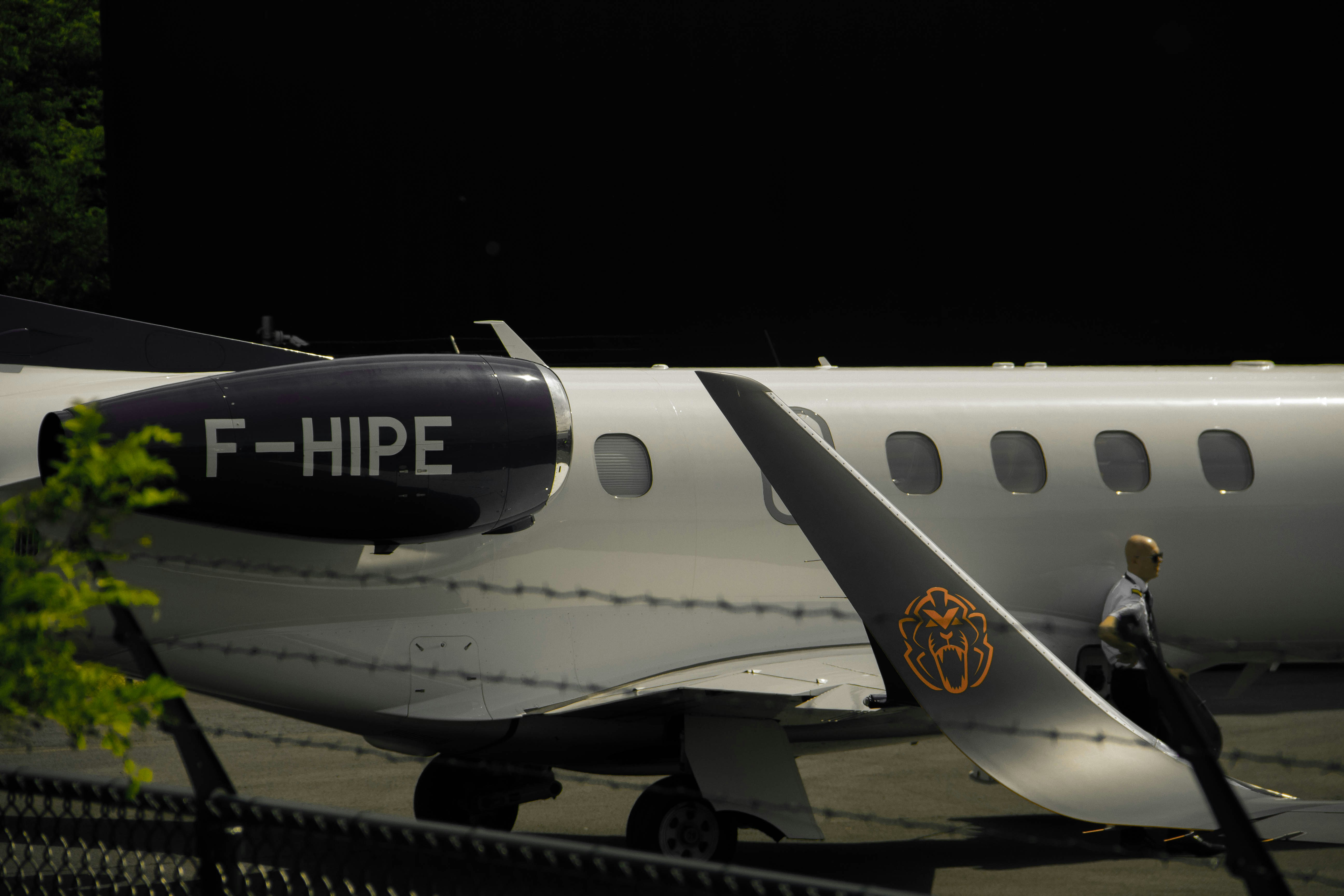 A small plane parked on the tarmac at an airport